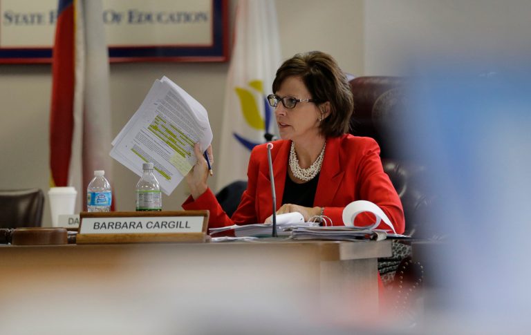 Texas Board of Education chair Barbara Cargill leads the groups meeting,Thursday, Nov. 21, 2013, in Austin, Texas. The Board of Education is casting critical votes on new science textbooks for use statewide, and on whether algebra II should be a required high school course.(AP Photo/Eric Gay)