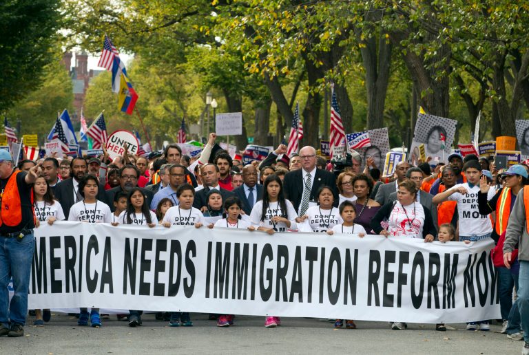 Demonstrators march towards on Capitol Hill during a immigration rally in Washington on Tuesday, seeking to push Republicans to hold a vote on a stalled immigration reform bill. (AP Photo/Jose Luis Magana)