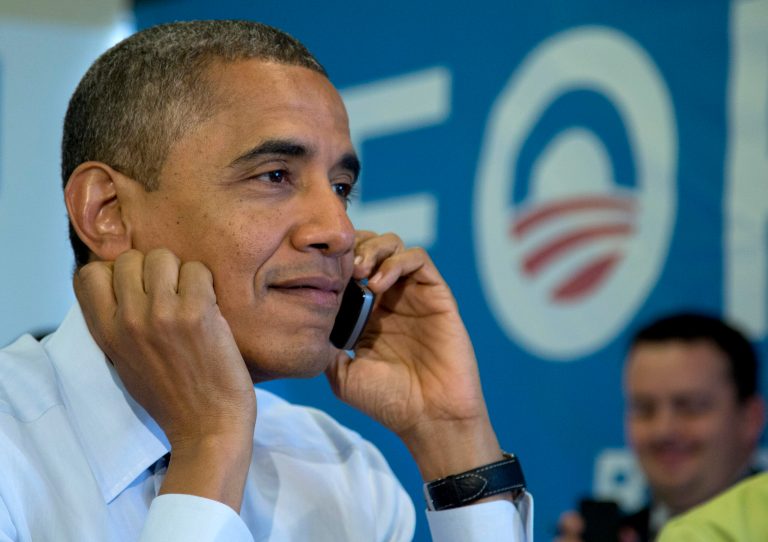 President Barack Obama calls Wisconsin volunteers as he visits a campaign office call center the morning of the 2012 election, Tuesday, Nov. 6, 2012, in Chicago. (AP Photo/Carolyn Kaster)