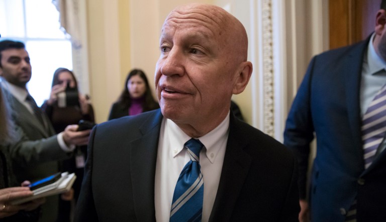 House Ways and Means Committee Chairman Kevin Brady, R-Texas, arrives at his office in the Capitol as House Republicans prepare to advance the GOP tax bill, in Washington, Friday, Dec. 15, 2017.
