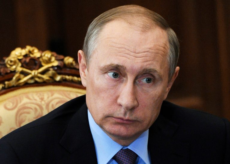 A State Department report outlined the authoritarian nature of Vladimir Putin's regime, and Josh Earnest said he doesn't see daylight between it and Joe Biden's remarks. (AP Photo)