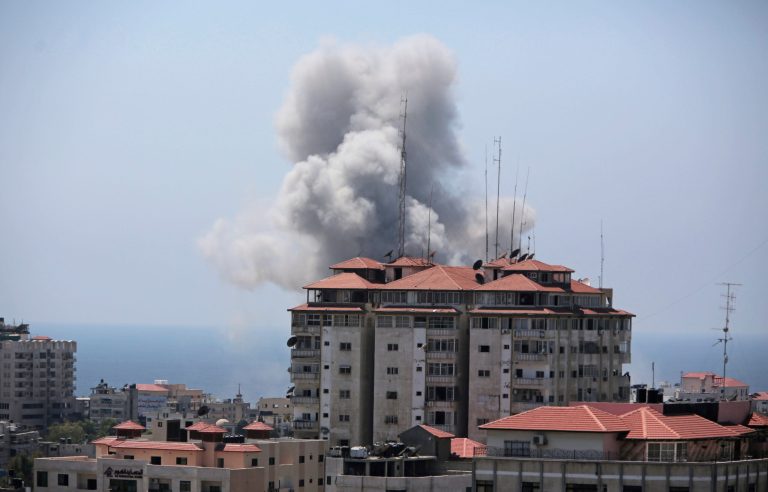Smoke raises in the air following an Israeli strike in Gaza City on Sunday, July 27, 2014. (AP Photo/Khalil Hamra)