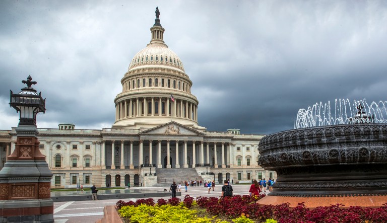 FILE- In this May 30, 2018, file photo the East Front of the U.S. Capitol in Washington is seen under stormy skies. On Tuesday, June 12, the Treasury Department releases federal budget data for May.