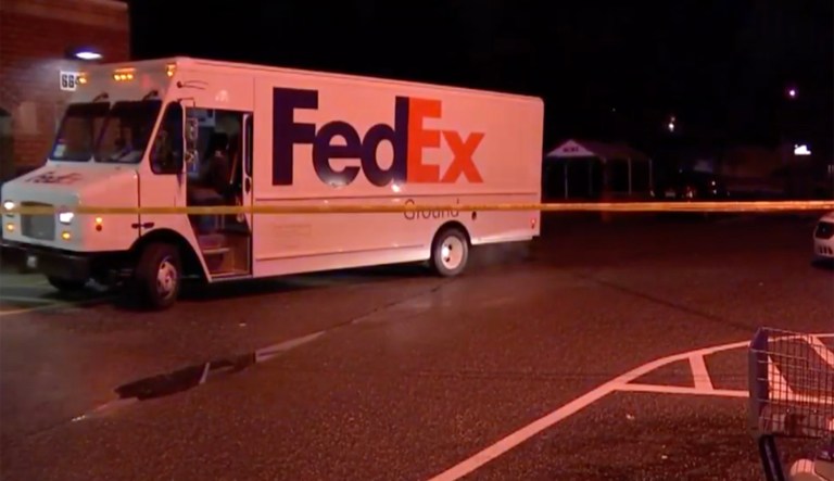 Injured FedEx driver shoots armed robber mid-delivery