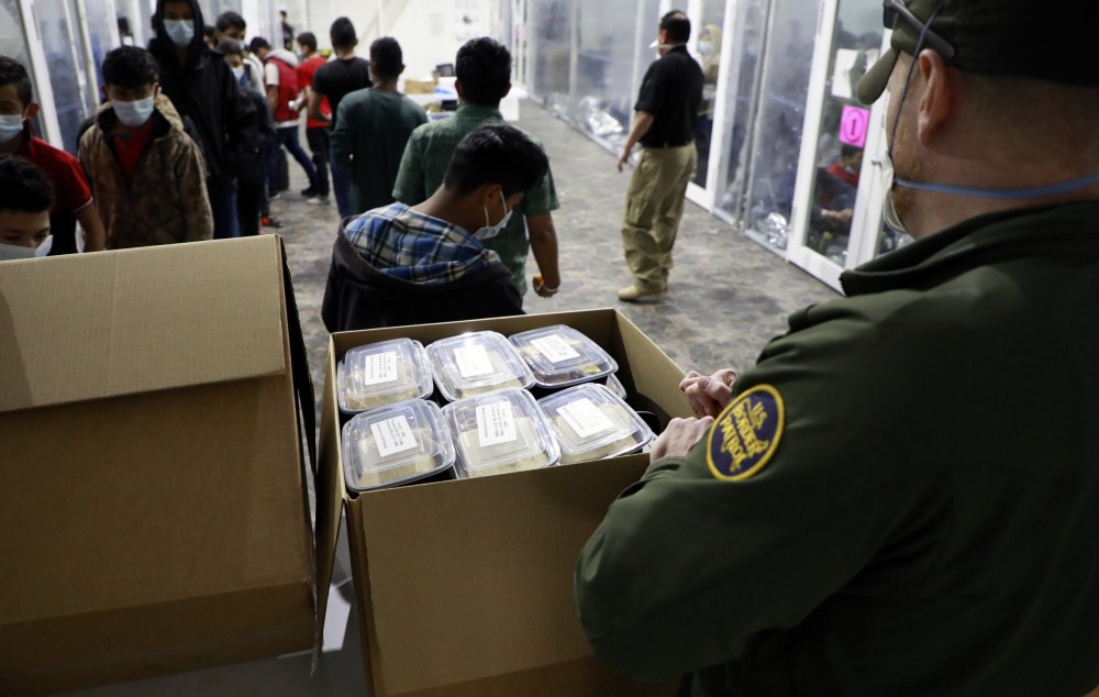 Photos: Agents pulled from border to feed, diaper illegal immigrants