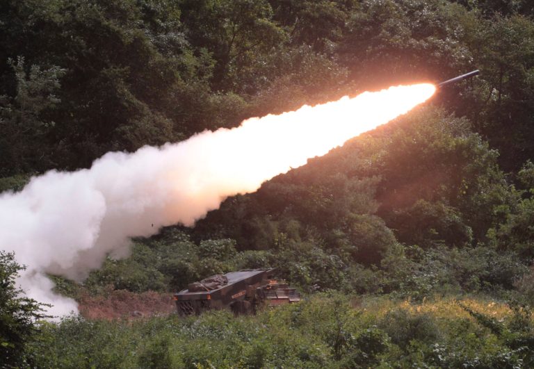 A rocket is fired by a U.S. Multiple Launch Rocket System vehicle during an U.S. military exercise near the demilitarized zone (DMZ) that separates the two Koreas since the Korean War, in Cheorwon, South Korea, Wednesday, Sept. 25, 2013. (AP Photo/Ahn Young-joon)