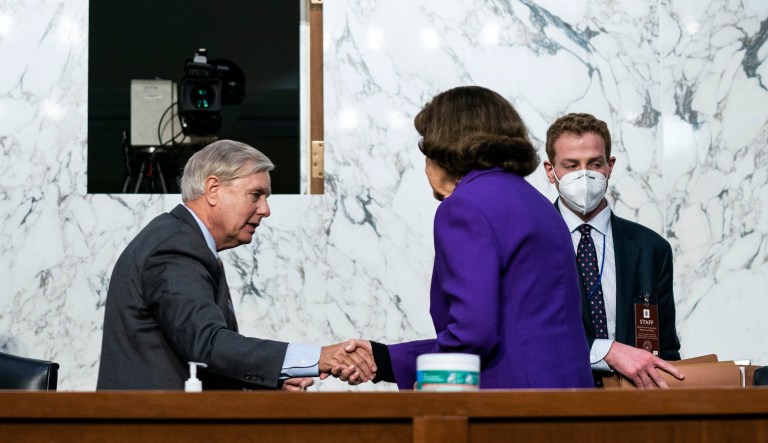 Sen. Lindsey Graham, R-S.C., shakes hands with Sen. Dianne Feinstein, D-Calif., following the fourth day of a confirmation hearing for Supreme Court nominee Amy Coney Barrett, before the Senate Judiciary Committee, Thursday, Oct. 15, 2020, on Capitol Hill in Washington.