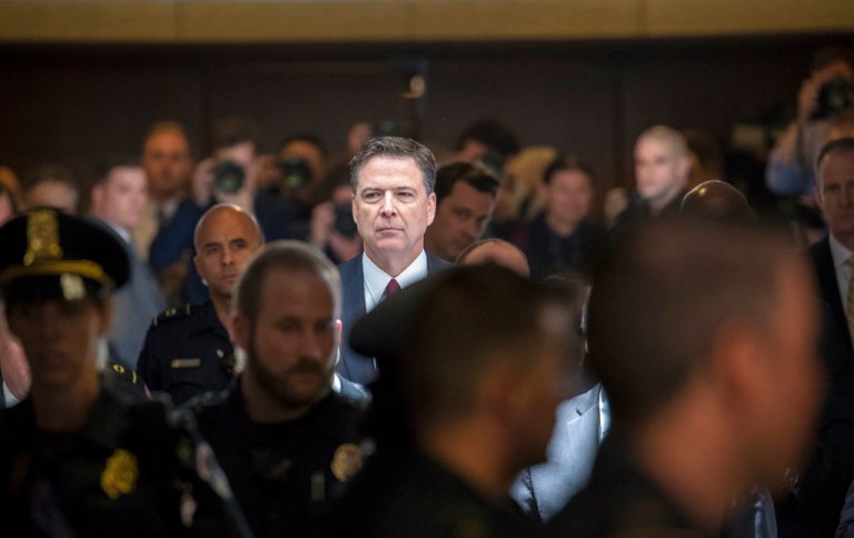 Former FBI director James Comey walks through a corridor on the way to a secure room to continue his testimony to the Senate Select Committee on Intelligence, on Capitol Hill in Washington, Thursday, June 8, 2017. Comey, who was fired by President Donald Trump, told the panel in open session that Trump repeatedly pressed him for his 