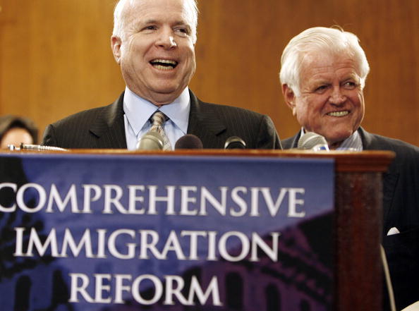 WASHINGTON - JUNE 27:  Sen. John McCain (R-AZ) (L) and Sen. Edward Kennedy (D-MA) laugh during an immigration reform rally and news conference on Capitol Hill June 27, 2006 in Washington, DC. When asked why the GOP House leadership was calling the Senate's version of the immigration reform legislation the 