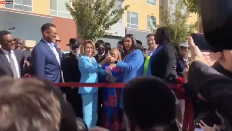 Nancy Pelosi struggles to cut ribbon with giant scissors