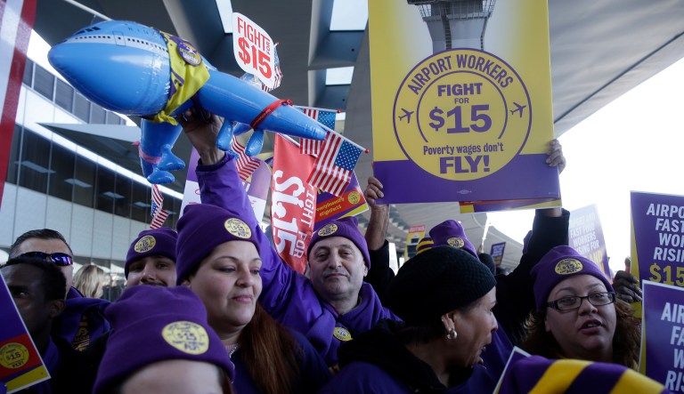 Protesters gather at Chicago's O'Hare International Airport on Tuesday, Nov. 29, 2016, as part of a nationwide protest for a $15 per hour minimum wage. Fast-food restaurant and airport workers, as well as home and child-care workers rallied in cities including Chicago, Detroit, Houston, Los Angeles, Minneapolis and New York on Tuesday morning.
