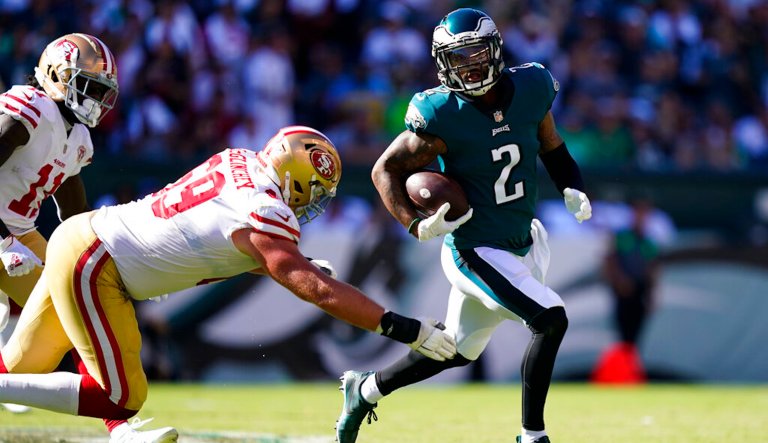 Philadelphia Eagles cornerback Darius Slay (2) runs with the ball past San Francisco 49ers offensive tackle Mike McGlinchey (69) during the second half of an NFL football game Sunday, Sept. 19, 2021, in Philadelphia.