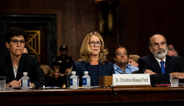 Christine Blasey Ford, center, arrives for a Senate Judiciary Committee hearing in Washington, D.C., U.S., on Thursday, Sept. 27, 2018. ChairmanÂ Chuck GrassleyÂ called for a "safe, comfortable and dignified" hearing Thursday on a sexual assault allegation againstÂ BrettÂ KavanaughÂ as the panel opened a historic hearing that promises to shape the Supreme Court's future and redefine the "Me Too" era.