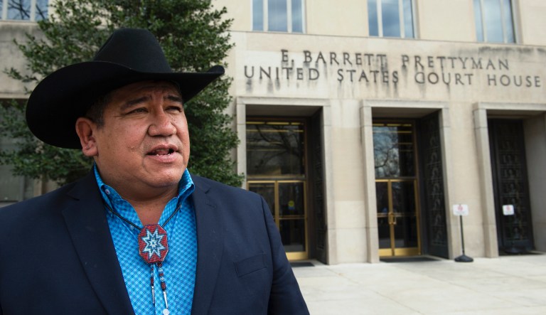 Chairman Harold Frazier of the Cheyenne River Sioux Tribe speaks with a reporter as he leaves the Federal Courthouse in Washington, Tuesday, Feb. 28, 2017. A Federal judge will consider a request by the Standing Rock and Cheyenne River Sioux tribes to order the Army Corps of Engineers to withdraw permission for developer Energy Transfer Partners to lay pipe under Lake Oahe in North Dakota.