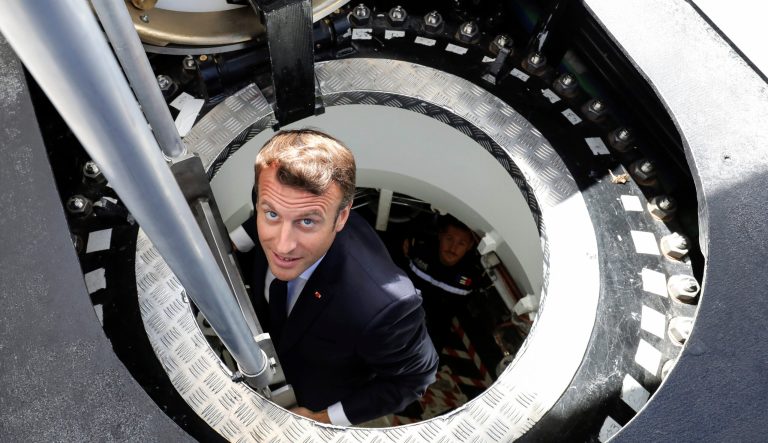 French President Emmanuel Macron gets out of the new French nuclear-powered submarine "Suffren." 
