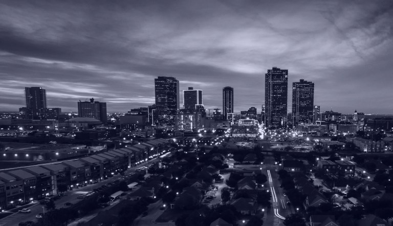A skyline of Fort Worth, Texas, is shown.