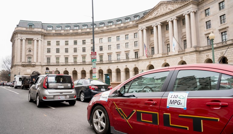Protesters with Environment America park fuel efficient vehicles outside the Environmental Protection Agency as Environmental Protection Agency Administrator Scott Pruitt holds a news conference on his decision to scrap Obama administration fuel standards, in Washington, Tuesday, April 3, 2018.