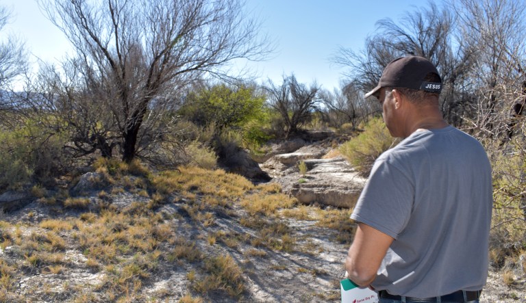 Pastor Victor Fuentes views the moonscape left of his oasis after the Fish & Wildlife Service flooded his lands four times in five and a half years.