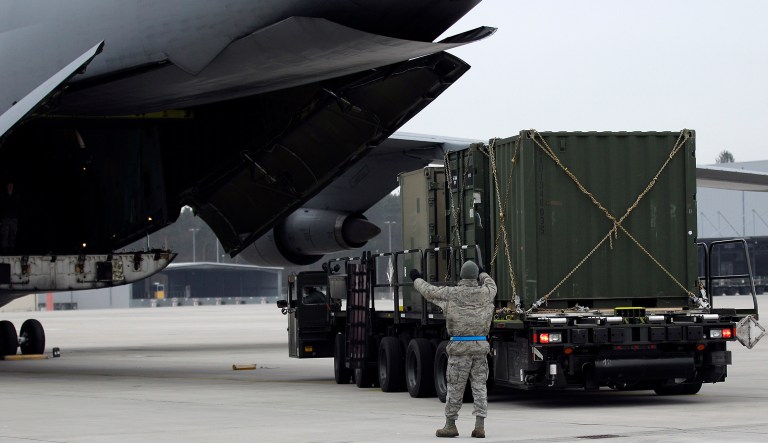 US Air Force airmen load cargo of the 10th Army Air and Missile Defense Command for deploying to Turkey at the  US Air Base in Ramstein, Germany, Tuesday, Jan. 8, 2013 as part of efforts meant to protect the NATO (North Atlantic Treaty Organization) ally from potential Syrian warheads. The US, Germany and the Netherlands are each deploying two batteries of the US-built defense system to boost Turkey's air defenses against any spillover from Syria's nearly two-year civil war.