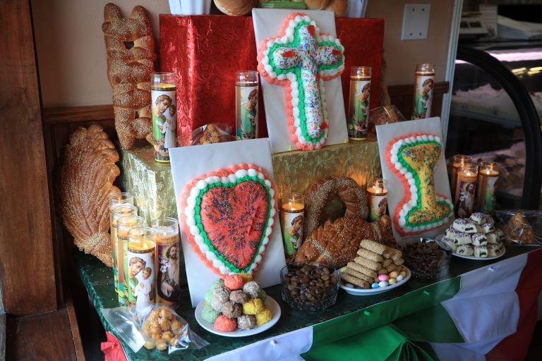 A St. Josephâs Day altar sits behind glass at Angelo Brocato's Italian Ice Cream Parlor on March 19, 2020, in New Orleans, Louisiana. St. Joseph's day, commemorated for the Catholic saint who protects communities during times of famine and sickness, is usually celebrated with altars, food, and a parade. 