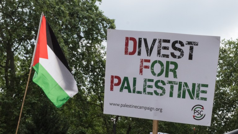 Students and pro-Palestinian supporters take part in a protest march through central London, calling for UK universities to stop investing and co-operating with companies and institutions involved in breaches of international law carried out by the Israeli government in the Palestinian territories in London on July 09, 2021.