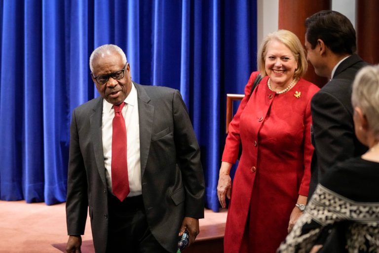 Supreme Court Justice Clarence Thomas and his wife, Virginia Thomas, arrive at the Heritage Foundation on October 21, 2021 in Washington, DC. 