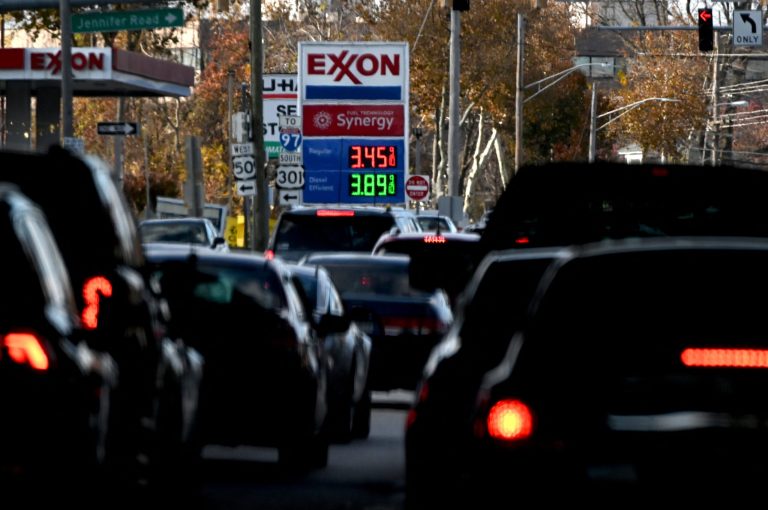 The price of gas is seen as traffic moves through Annapolis, Md.