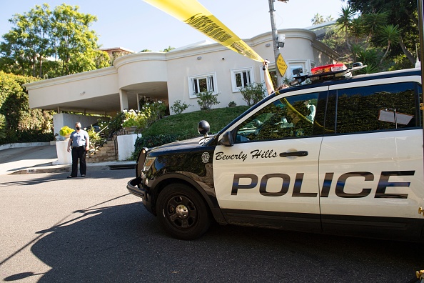A Yellow Police tape blocks access to the 1100 block of Maytor place where Jacqueline Avant's house is at the top of the hill, in Beverly Hills , California on December 1, 2021. - The wife of the man known as the 