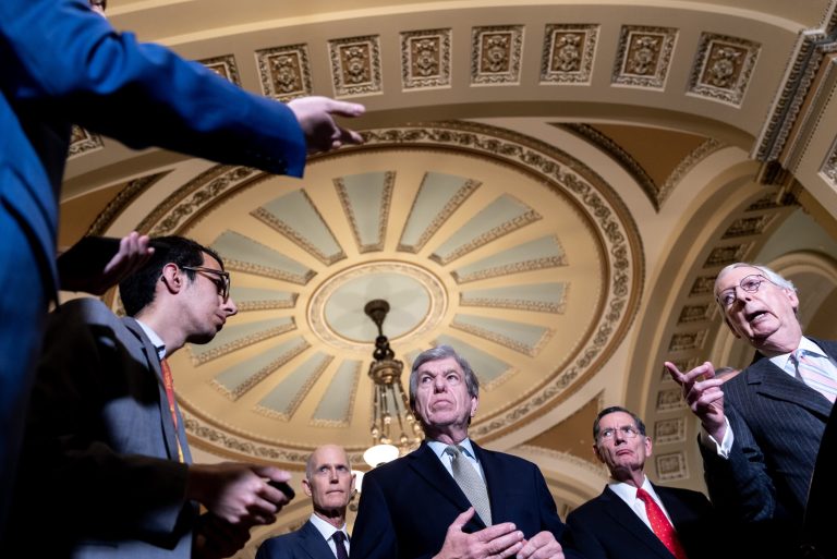 Senate Minority Leader Mitch McConnell, right, speaks about the America COMPETES Act, which aims to boost domestic innovation and provide billions for semiconductor manufacturing, during a news conference on March 22 on Capitol Hill. 