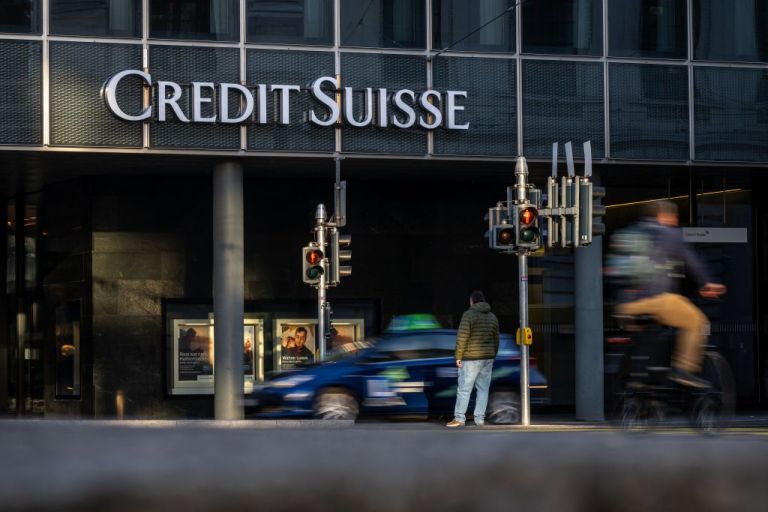 A picture taken on October 25, 2022, shows a sign of Switzerland's second-biggest bank Credit Suisse on a branch in Basel.