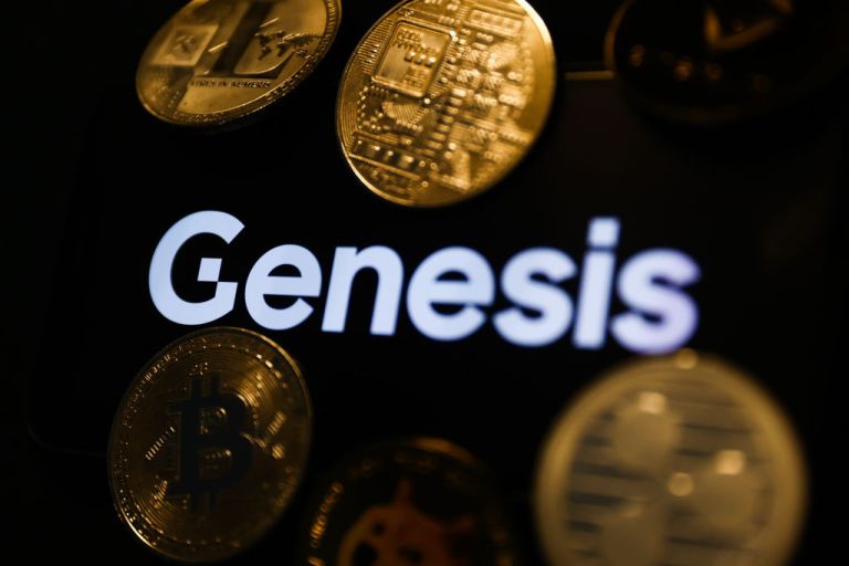 Genesis logo displayed on a phone screen and representation of cryptocurrencies are seen in this illustration photo taken in Krakow, Poland on December 1, 2022. 