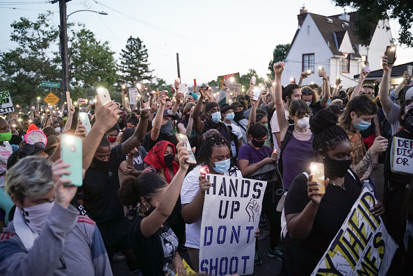 OAKLAND, CA - JUNE 10: Demonstrators light candles during a youth led protest to defund the Oakland Police Department in Oakland, Calif., on Wednesday, June 10, 2020.