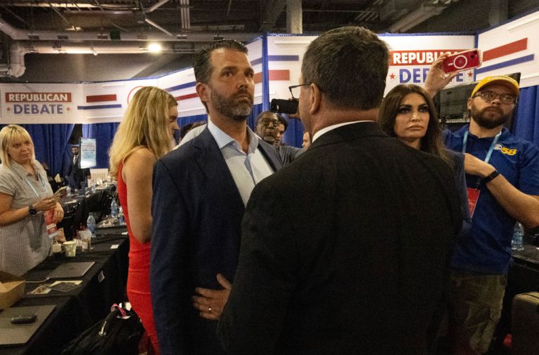 Donald Trump Jr. and fiancee Kimberly Guilfoyle are blocked from going into the spin room by security personnel.