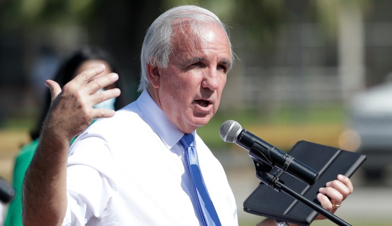 Miami-Dade County Mayor Carlos Gimenez gestures as he speaks during a news conference announcing the opening of some county facilities, Monday, April 27, 2020, in Miami. Miami-Dade, Broward and Palm Beach counties announced Monday they are reopening their parks, golf courses, marinas and some other recreation facilities this week with strict limitations. In Key West, beaches were reopened to residents although the Florida Keys remain closed to visitors.