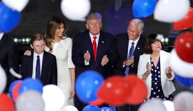 Republican presidential candidate Donald Trump, center, watches balloons fall alongside son Barron, from left, wife Melania, Republican vice presidential nominee Gov. Mike Pence of Indiana and Pence's wife Karen after Trump's address to delegates during the final day session of the Republican National Convention in Cleveland, Thursday, July 21, 2016.