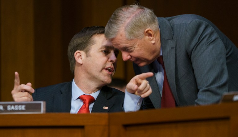 Senate Judiciary Committee Chairman Lindsey Graham, R-S.C., right, speaks with Sen. Ben Sasse, R-Neb., as Attorney General nominee William Barr testifies before the Senate Judiciary Committee on Capitol Hill in Washington, Tuesday, Jan. 15, 2019.                                          