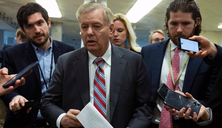 Senate Judiciary Committee Chairman Lindsey Graham, R-S.C., speaks to reporters as he walks  to the Senate chamber, on Capitol Hill in  Washington, Wednesday, Jan. 22, 2020.