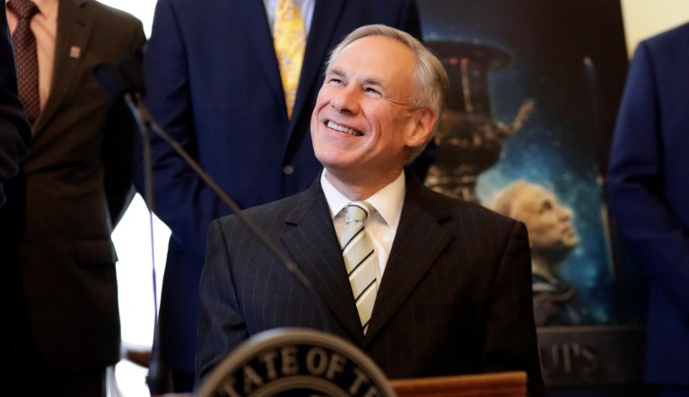 A poster with an image of Texas Gov. Greg Abbott is seen behind Abbott at a news conference where he was presented the Governor's Cup by Site Selection Magazine, Monday, March 4, 2019, in Austin, Texas. Texas won for having the most qualified projects of any state according to their data.