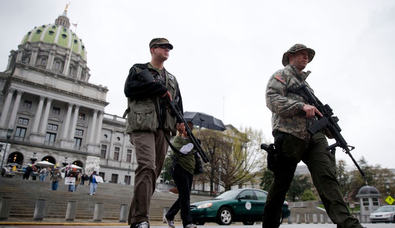 Gun rights advocates Stephen Korte, right, and his brother Austin Barnes walk from the of the state Capitol after a rally on Tuesday, April 29, 2014, in Harrisburg, Pa. The event titled Pennsylvania Second Amendment Action Day which dates back to 2006, focuses on Second Amendment issues.