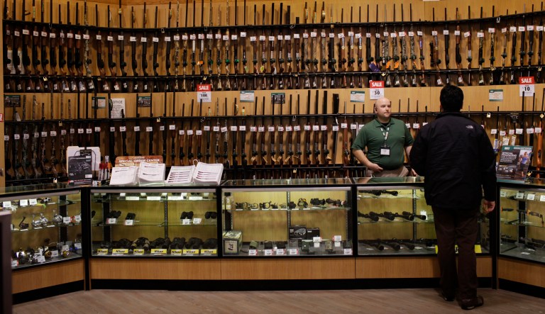 A customer looks at guns at Dick's Sporting Goods Inc. in Paramus, New Jersey, U.S. on Tuesday, March 6, 2012.
