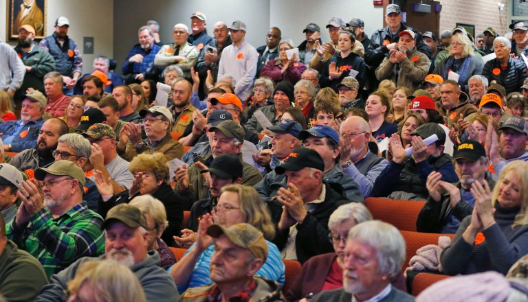 Spectators applaud as the Buckingham County Board of Supervisors unanimously voted to pass a Second Amendment Sanctuary City resolution at a meeting in Buckingham , Va., Monday, Dec. 9, 2019. 