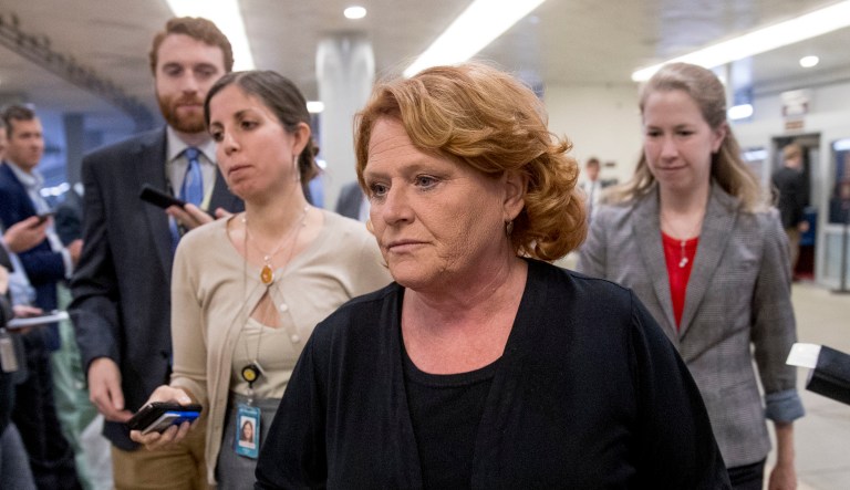 Sen. Heidi Heitkamp, D-N.D., walks through the Senate Subway as she arrive at the Capitol for policy luncheons, Tuesday, Sept. 25, 2018, in Washington.