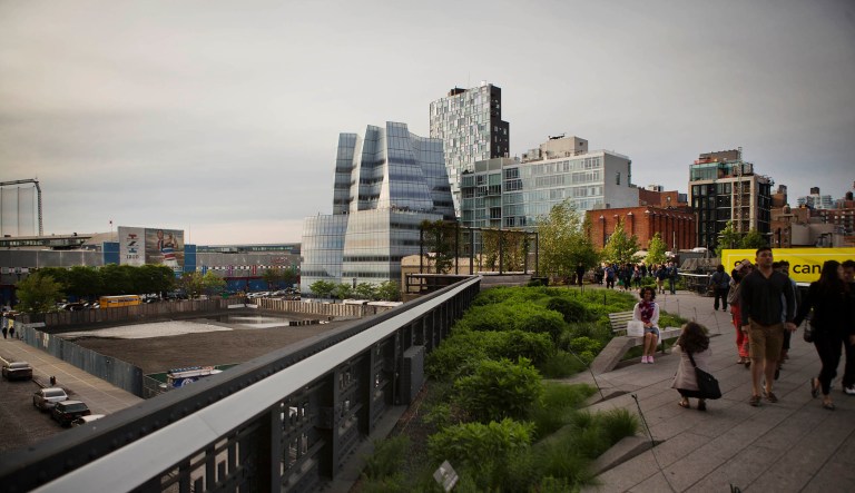 Visitors walk on the High Line in the Chelsea neighborhood of New York, on Wednesday, May 20, 2015.