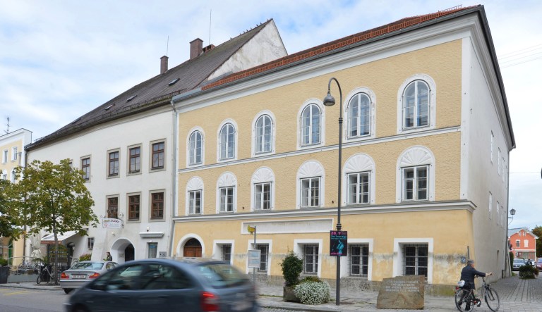 FILE - This Sept. 27, 2012 file picture shows an exterior view of Adolf Hitler's birth house , front, in Braunau am Inn, Austria. Austrian authorities say the house where Adolf Hitler was born in 1889 will become a police precinct, ending years of uncertainty over the building that's become a pilgrimage site for people who glorify the Nazi dictator.