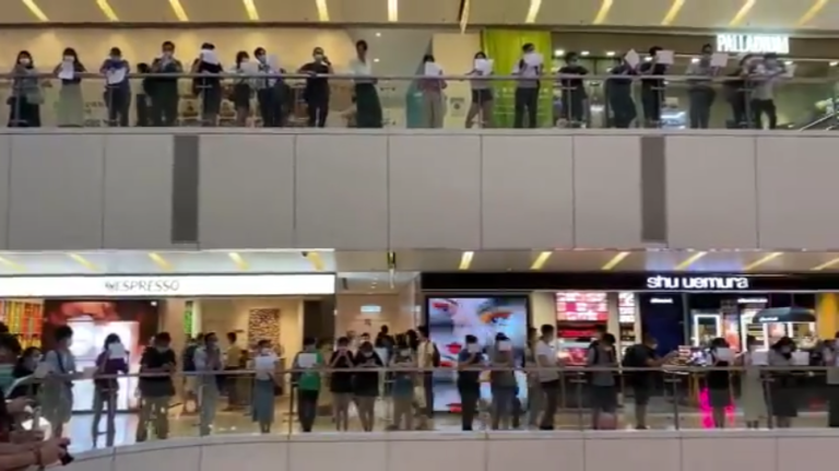 Eight Hong Kong protesters arrested at peaceful blank sign protest