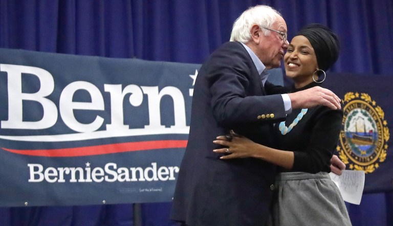 Democratic presidential candidate Sen. Bernie Sanders, D-Vt., and Rep. Ilhan Omar, D-Minn., hug after she introduced him at a campaign event, Friday, Dec. 13, 2019, in Manchester, N.H. 
