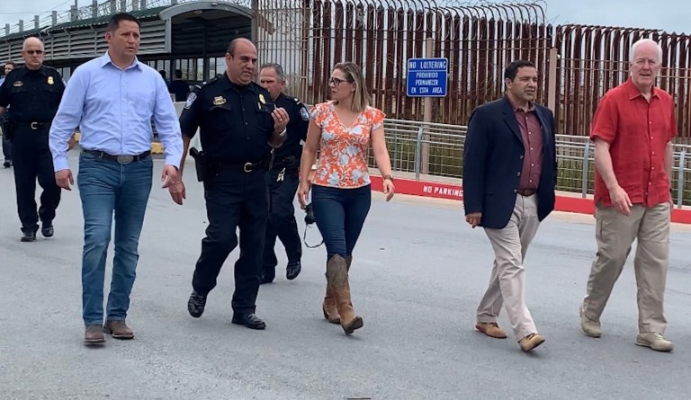 Sens. John Cornyn, R-Texas, and Kyrsten Sinema, D-Ariz., along with Reps. Henry Cuellar, D-Texas, and Tony Gonzales, R-Texas, walk to the McAllen-Hidalgo International Bridge port of entry.
