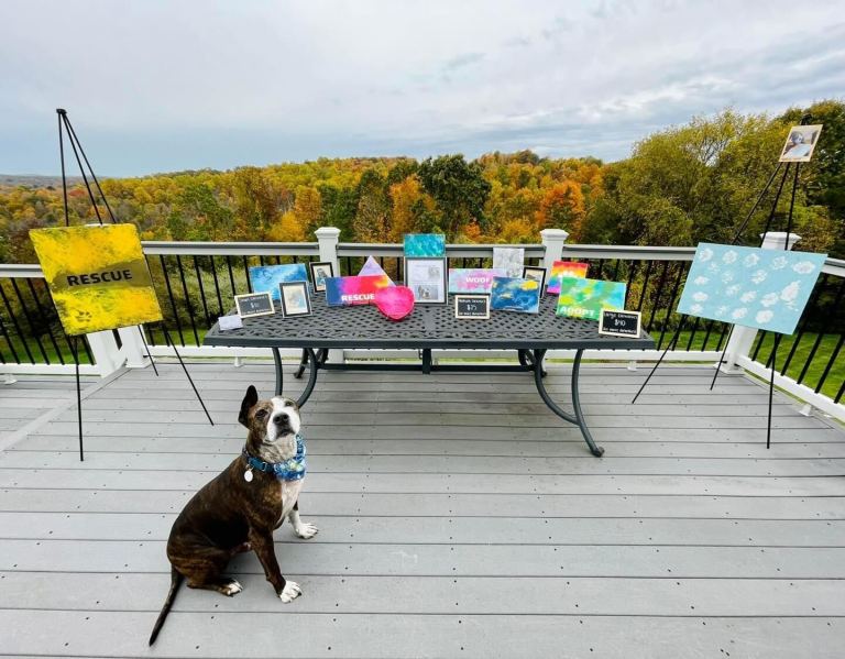 Van Gogh sits and waits for his guests to arrive at his first art show.