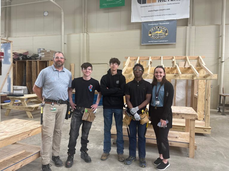CINCINNATI â Kurt Helmets, the carpentry instructor at Great Oaks, with four of his students.