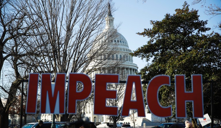 Public support for impeachment drops as House votes against Trump